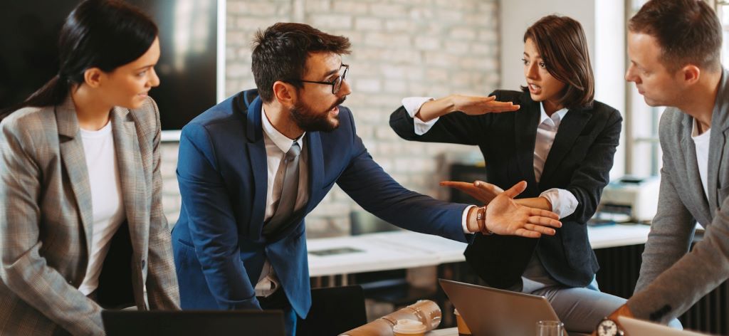 Individual listening attentively and maintaining composure while engaged in a challenging discussion